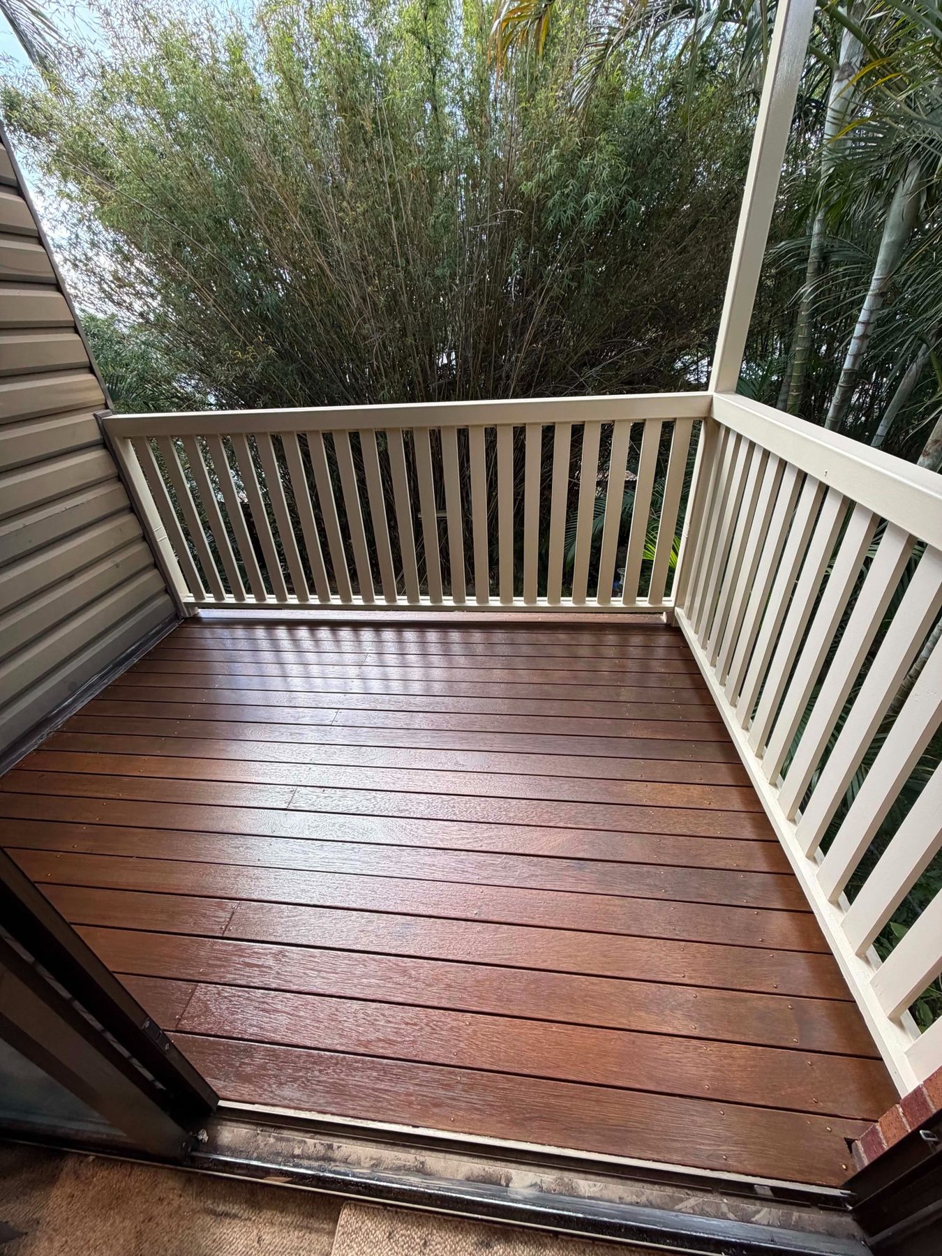 Finished timber balcony and white balustrade