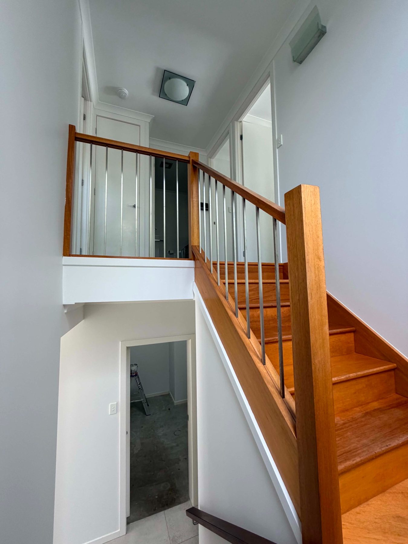 White stairwell repaint around natural timber staircase